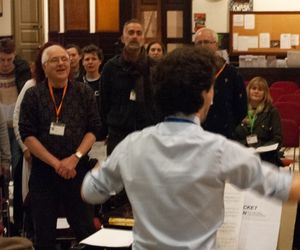 Tim's back to the camera looking out at the choir